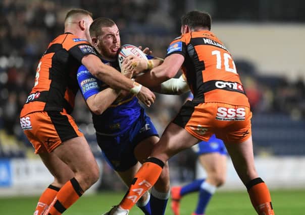 Leeds Rhinos Cameron Smith is tackled by Castleford Tigers' Liam Watts and Grant Millington.
 (
Picture: Jonathan Gawthorpe)