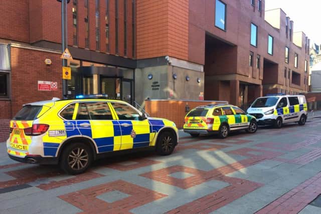 Police and paramedics outside Leeds Crown Court