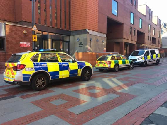 Police and paramedics outside Leeds Crown Court