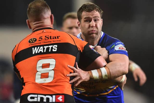 Trent Merrin is tackled by Liam Watts.