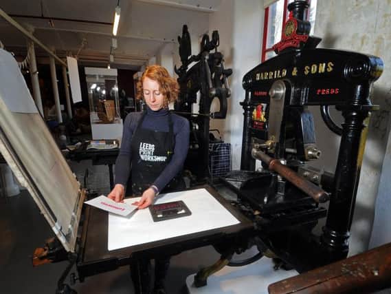 Founding member of Leeds Print Workshop Kirstie Williams using the museums 169-year-old Albion Press,  back up and running for a special demonstration of traditional letterpress printing. Picture: Tony Johnson.