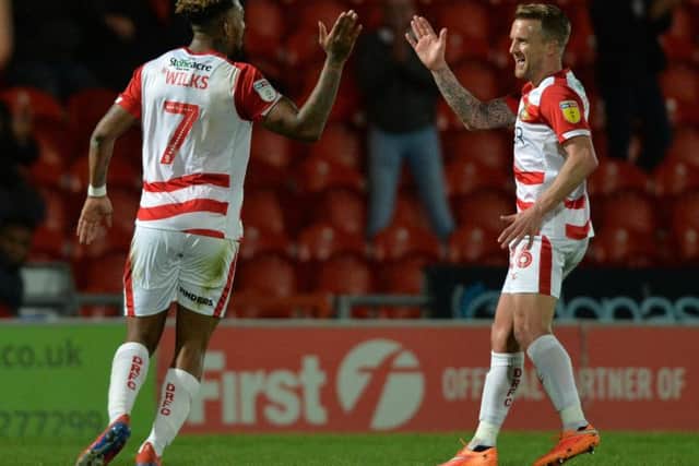 Doncaster Rovers striker Mallik Wilks celebrates.