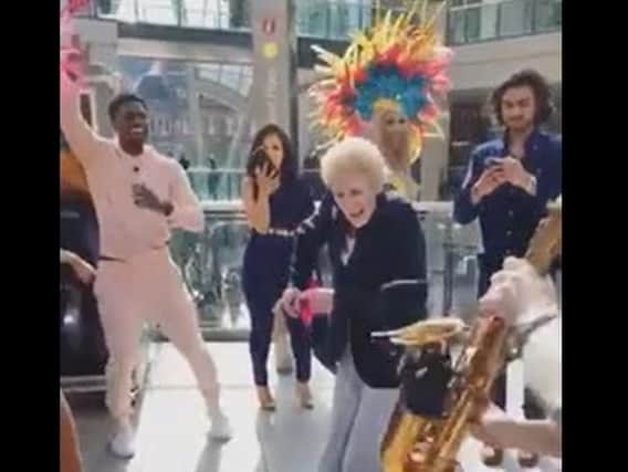 Sylvia Nolan was filmed when she dropped her handbag and got her groove on to music being played at Trinity shopping centre on Saturday