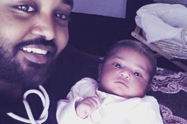 Muhanad Adem with his daughter Sadenselwa. Muhanad's partner Selwa Romedan, 21, died from an undiagnosed heart condition four days after giving birth.
