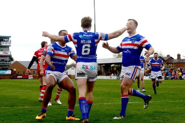 Jacob Miller celebrates after scoring against Salford.