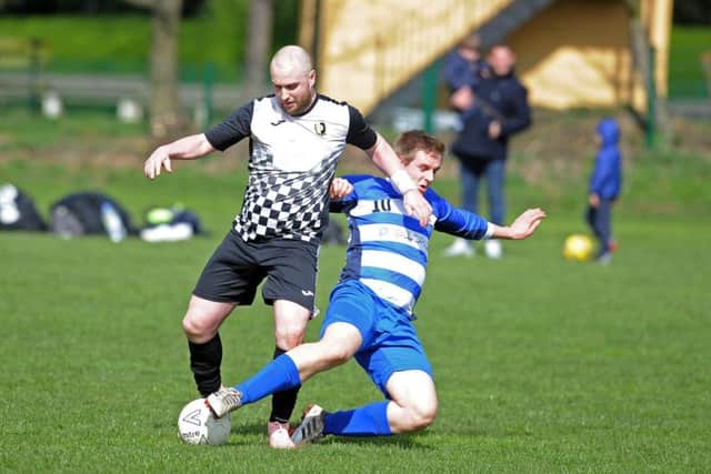 Headingley's Nick Cader tackles Charlie Sopp, FC Rothwell Sundays. PIC: Tony Johnson