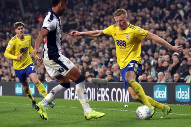Birmingham City's Kristian Pedersen attacks West Bromwich Albion.