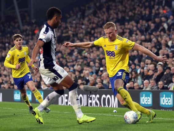 Birmingham City's Kristian Pedersen attacks West Bromwich Albion.