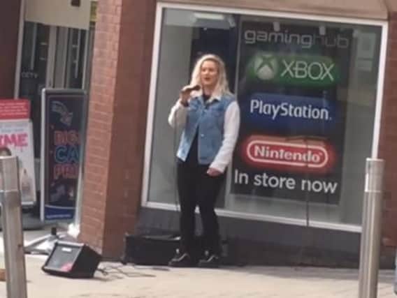 Chloebeth Hamer busking in Leeds city centre and shocking shoppers with her opera voice. Video: Pamela Wilson.