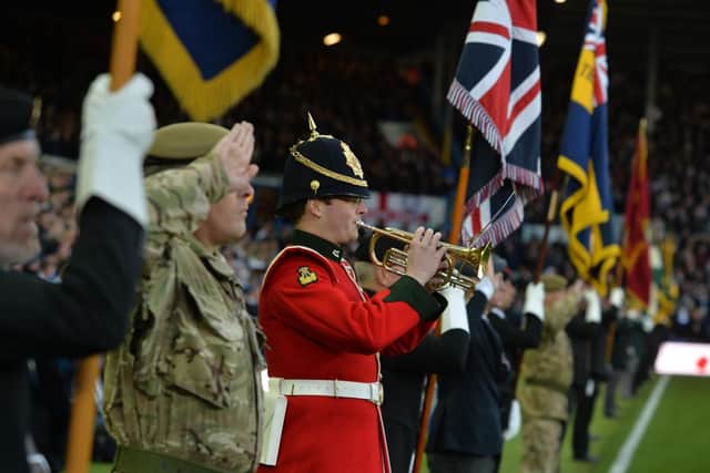 A bugler plays the Last Post before Leeds United's Remembrance fixture last year.