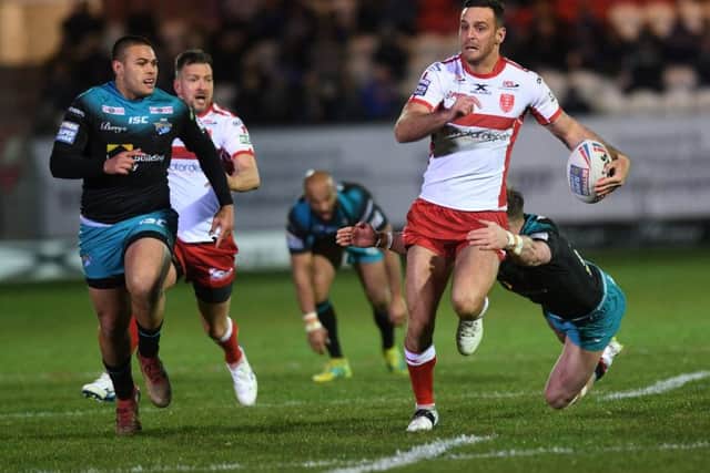 Craig Hall escapes James Donaldson's tackle.