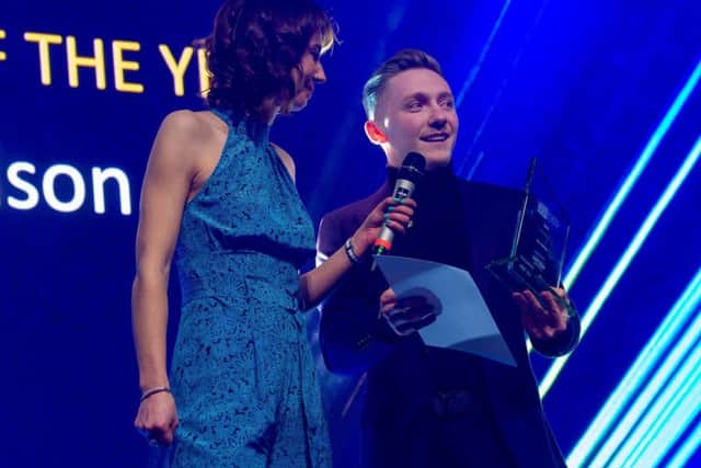 Nile Wilson receives his Sportsman of the Year award at the Leeds Sports Awards from Tanya Arnold.