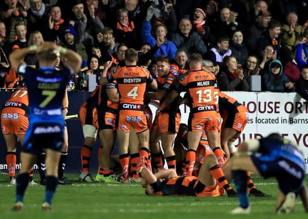 Castleford Tigers celebrate after Peter Mata'utia scores his side's final try with the last touch of the game.