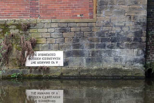 The sign on the Leeds Liverpool canalIt reads: 'The Remains of a Wooden Icebreaker Lie Submerged' and is found near the Leeds Industrial Museum, Armley Mills.