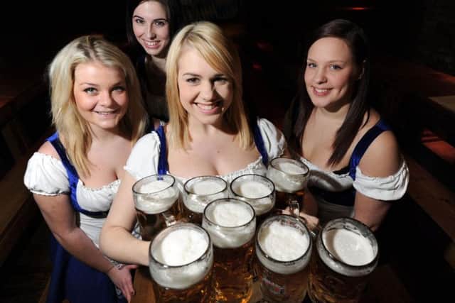 Waitresses at the Bierkeller, Leeds, with some two pint steins.