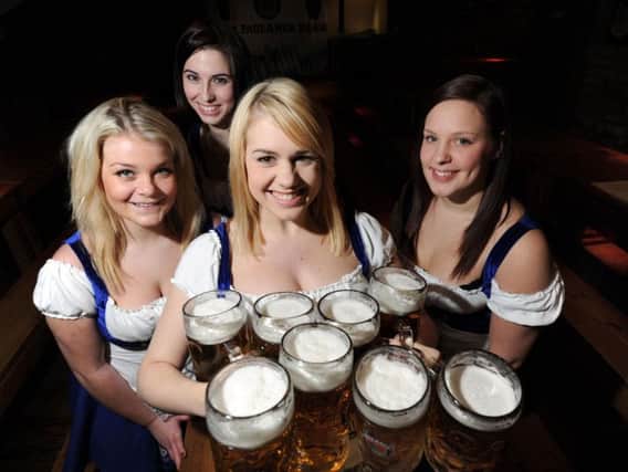 Waitresses at the Bierkeller, Leeds, with some two pint steins.
