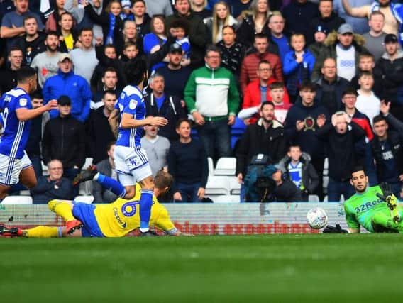 SOLID: Leeds United's Spanish goalkeeper Kiko Casilla makes one of six saves at St Andrew's to prevent Birmingham City striker Che Adams from netting a second. Picture by Jonathan Gawthorpe.