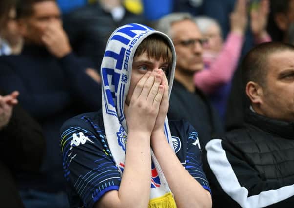 A Leeds United fan shows his frustration after the final whistle at St Andrews.