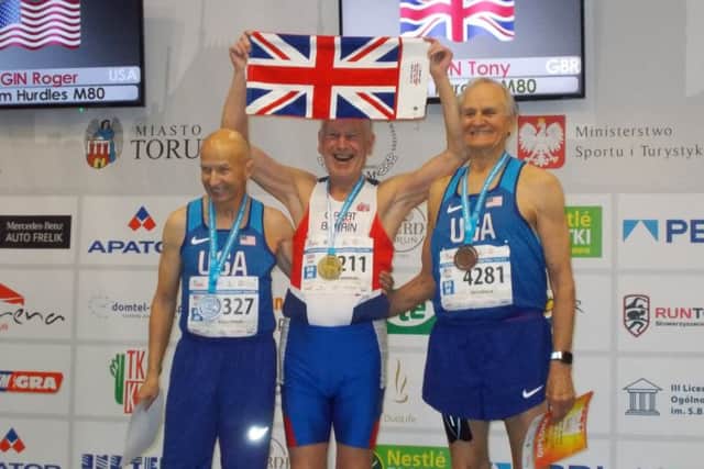 Tony Bowman, centre, with his gold medal.