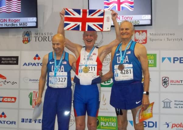 Tony Bowman, centre, with his gold medal.