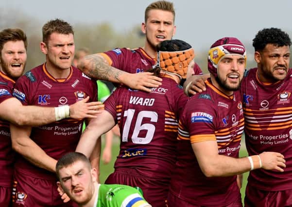 Batley players celebrate during their victory over Widnes Vikings.