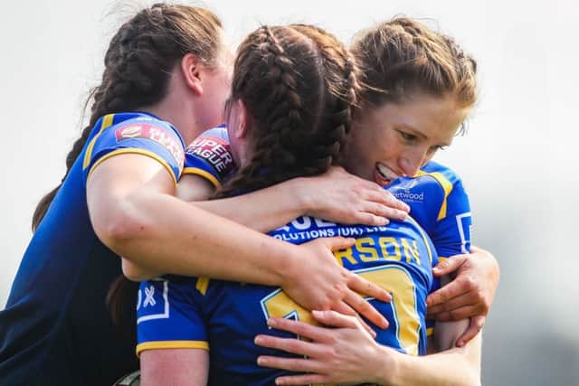 Leeds' Dannielle Anderson celebrates her try against Wakefield with Shannon Lacey (left) and Caitlin Beevers.