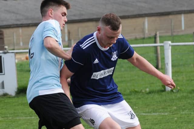 Adam Fowler, of Leeds City, takes on Carlton's Ben Scargill. PIC: Steve Riding