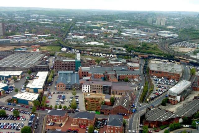 An aerial shot of Holbeck Viaduct clearly shows its route. The Monk Bridge viaduct is just out of shot behind the car park and large black building in the right-hand corner of the photo