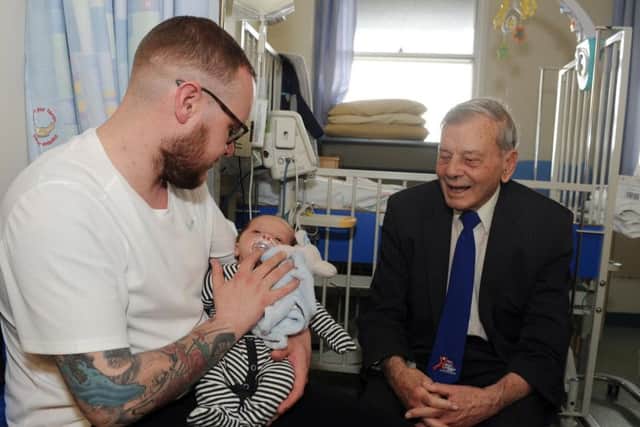 Dickie Bird chats to Jamie Young and baby son Toby.