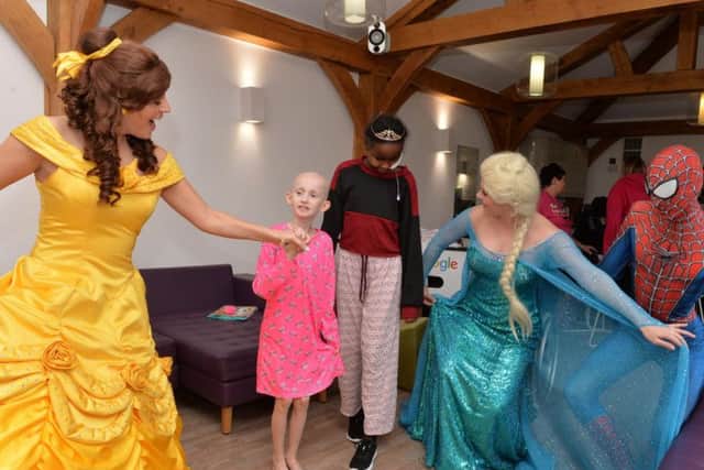 Parties for My Princess:  Belle, Elsa and Spiderman entertain Lacey and Tume at Leeds Chkildren's Hospital.
Picture: Bruce Rollinson