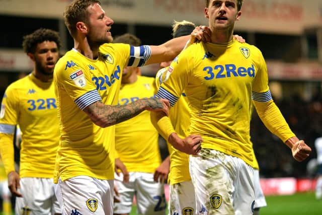 WHAT YOU SAYING?: Leeds United striker Patrick Bamford is congratulated by skipper Liam Cooper after his stunning opener in Tuesday night's 2-0 win at Preston North End. Picture by Bruce Rollinson.