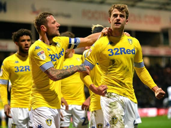 WHAT YOU SAYING?: Leeds United striker Patrick Bamford is congratulated by skipper Liam Cooper after his stunning opener in Tuesday night's 2-0 win at Preston North End. Picture by Bruce Rollinson.