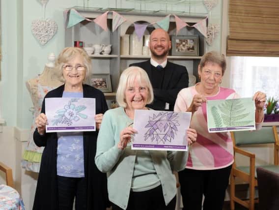 David Wood, Anchors community partnership manager with  Val Ashford, Ann Paul and Maureen Jones, residents at Halcyon Court care home in in Cliff Road, Headingley.
Pensioners living at Halcyon Court -  along with residents at Beech Hall in Armley, and Oak Tree Lodge in Gipton - have designed postcards that will be placed in community hubs across the city.
 The aim is for people to send the postcards back to the residents so they can start writing to each other. 
Picture: Tony Johnson