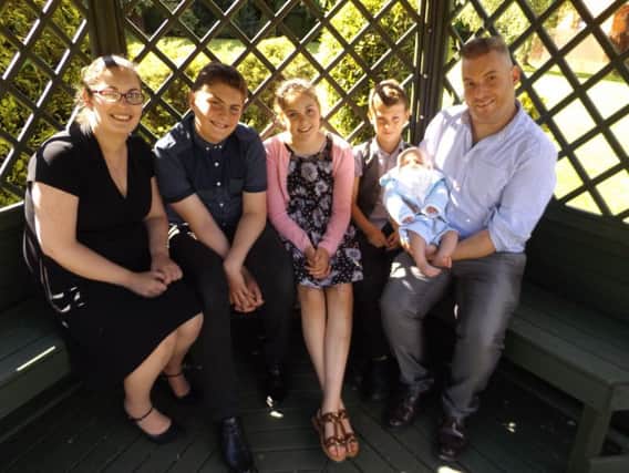 Hannah Buxton with family members Owen, Evie, Harry, Austin and David.