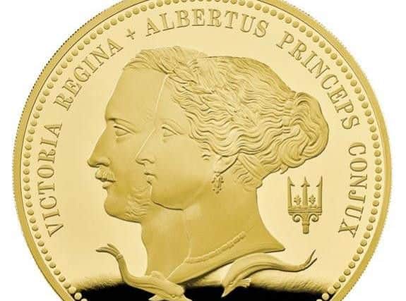 The most expensive, gold version of the new 5 coin.