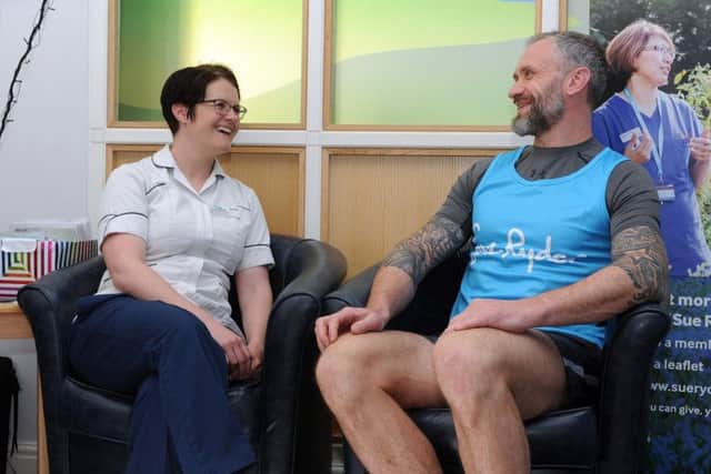 Jamie Peacock MBE, chats with physiotherapist Rhea Sutcliffe at Sue Ryder Wheatfields Hospice in Leeds 
Picture Tony Johnson.