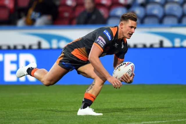 Castleford's Greg Eden goes over to score the opening try at Huddersfield.