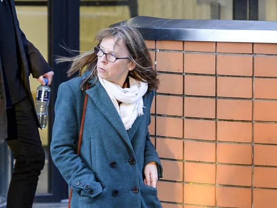 The mother of Poppy Devey Waterhouse, Julie Devey, leaves Leeds Crown Court. Picture: SWNS