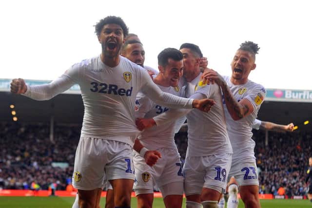Leeds United's Jack Harrison, centre, is mobbed by his team-mates after scoring the winning goal. Picture by Tony Johnson.