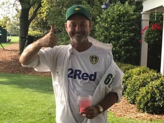 Caddie Billy Foster sporting his Leeds United colours at the Masters.