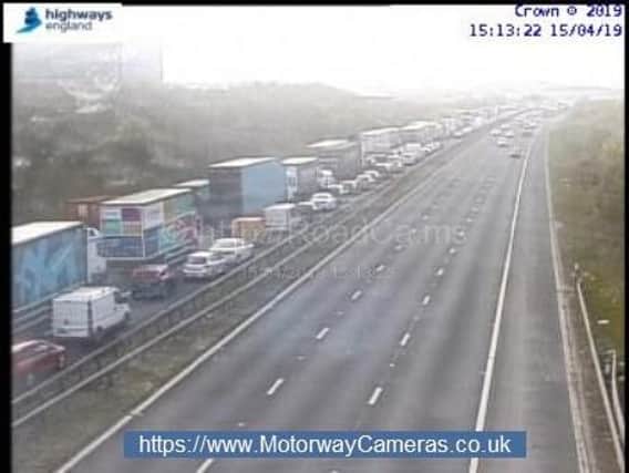 Traffic held on the M62 near Rothwell due to a pedestrian on the carriageway