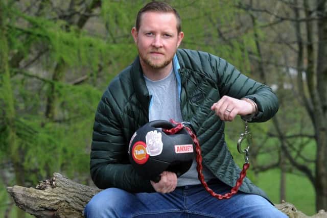 Army veteran Christian Kisby a Yorkshire Regiment veteran who is spending a week with a 15kg weighted ball handcuffed to his wrist in a bid to raise awareness of PTSD in soldiers