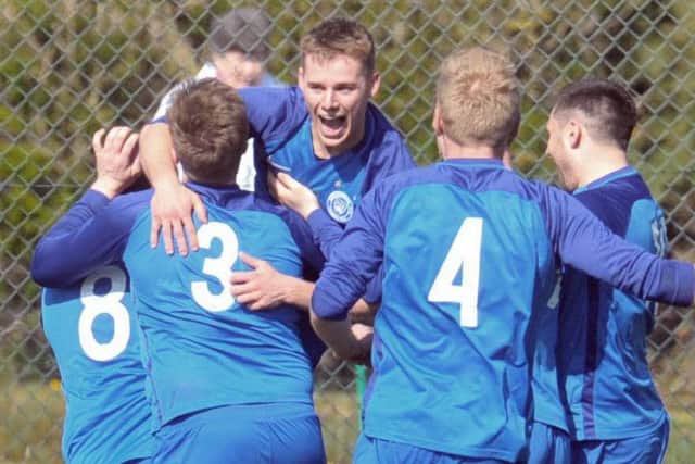 Phil Milsom celebrates his second goal in Boroughbridge's 4-2 win over Hall Green United. PIC: Steve Riding