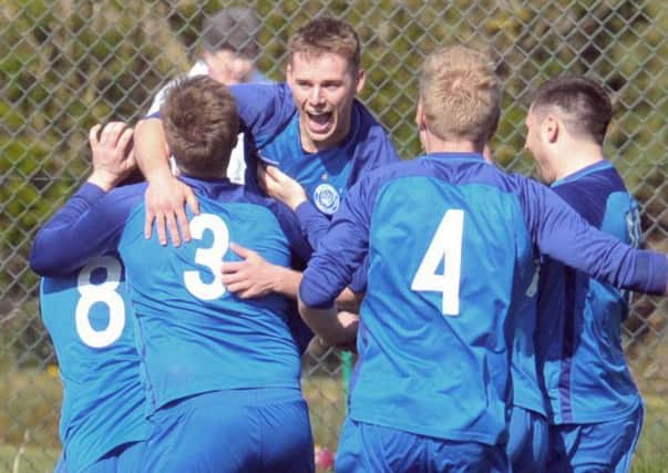 Phil Milsom celebrates his second goal in Boroughbridge's 4-2 win over Hall Green United. PIC: Steve Riding