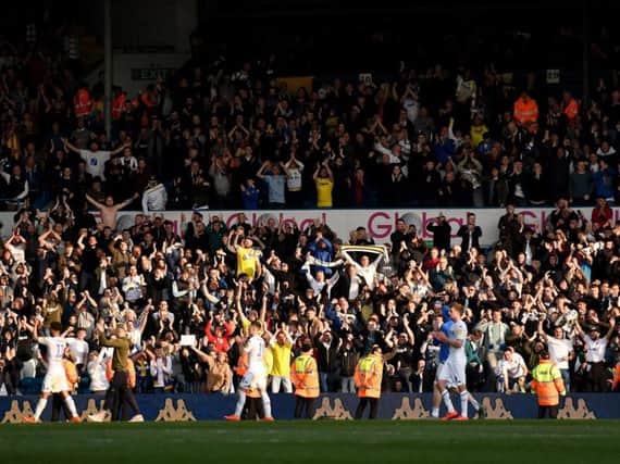 Leeds United fans salute players at Elland Road.