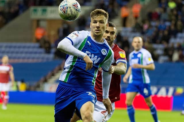 WHITES FAN: Wigan Athletic midfielder Lee Evans.