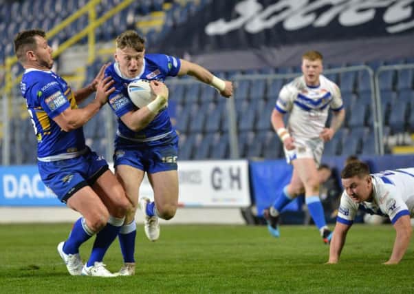 Harry Newman scores his fourth try against Workington in the Challenge Cup.
