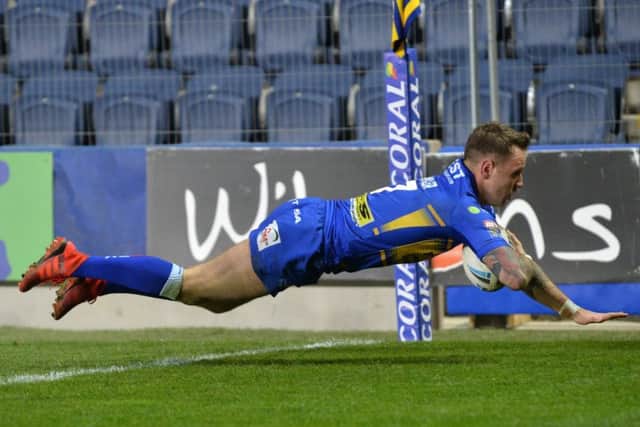 Richie Myler dives over for his second try against Workington.