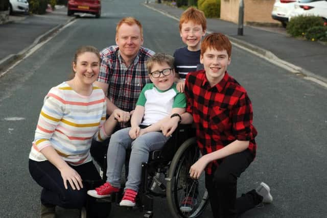 Alex and Warren Ashurst with ten-year-old Euan, who has progressive muscle wasting condition Duchenne muscular dystrophy, and brothers Rory and Luke.