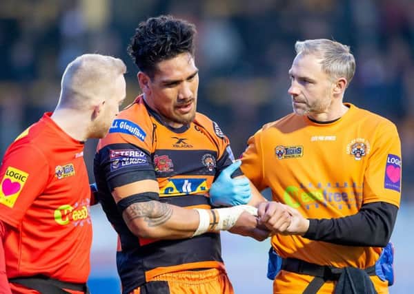 Castleford's Jesse Sene-Lefao is helped off the pitch after dislocating his shoulder against Wakefield yesterday.
